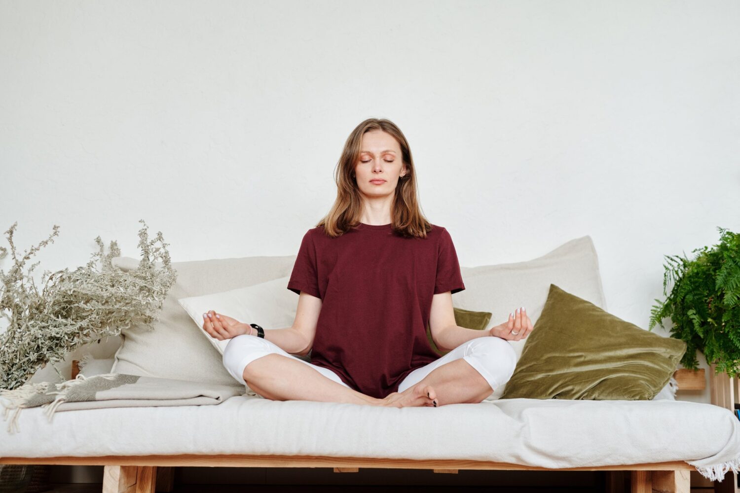 meditating woman on bed